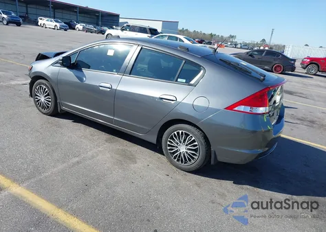 2011 Honda Insight from USA, damaged, VIN JHMZE2H3XBS005408